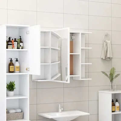 A bathroom scene with a white cabinet and sink.