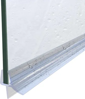 A close-up view of a shower door seal attached to a glass shower door, with water droplets on the glass and seal.