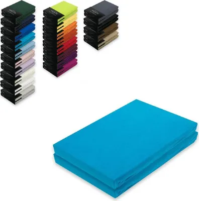 A collage of stacked fabric items and a folded fabric item.