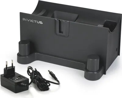 A black charging dock and power adapter for a cleaning device.