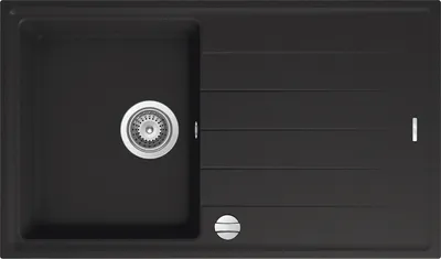A top-down view of a black kitchen sink with a silver drain and faucet.