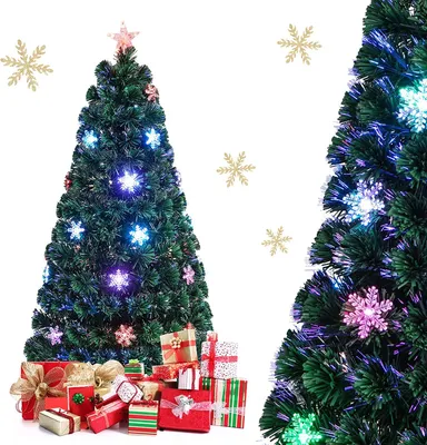 A decorated artificial Christmas tree with presents underneath, set against a white background with snowflake decorations.