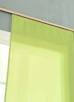 A close-up of a light green curtain hanging from a curtain rod.
