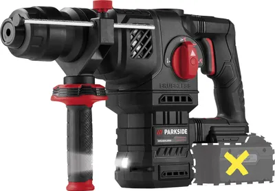 A black and red cordless rotary hammer drill is shown against a white background. A yellow 'X' symbol is overlaid on a grayed-out representation of a battery pack at the bottom right of the image.