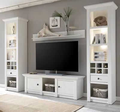 A living room setting with a TV and storage units.