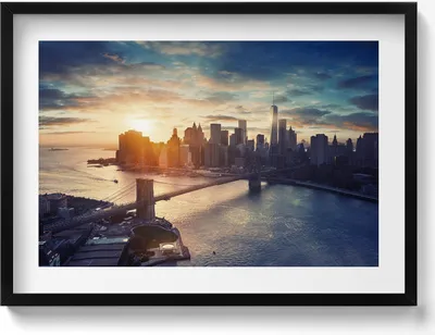 Produktbild von New York Manhattan und Sonnenuntergang– Wandbild mit Rahmen – Gerahmtes Bild  – Wanddekoration – 70x50 cm –  Schwarz Rahmen