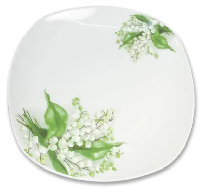 A white plate with a floral pattern of lily of the valley flowers.