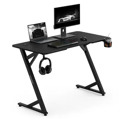Obrázek produktu pro Sense7 VAMO, herní stůl, 120x60 cm, černý, počítačový stůl, PC stůl, design s karbonovým vzhledem, herní stůl ve tvaru "Z" s držákem na nápoje, vhodný pro domácí kancelář a kanceláře