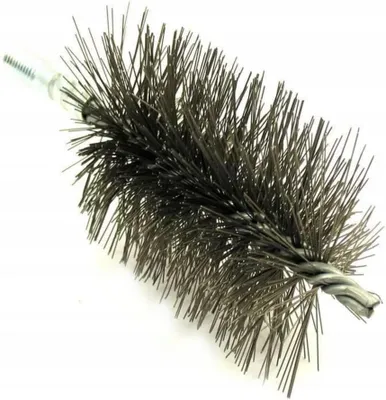 A close-up view of a chimney brush with metal bristles.