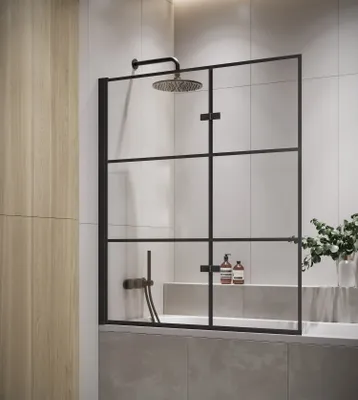 A modern bathroom with a shower screen over a bathtub.