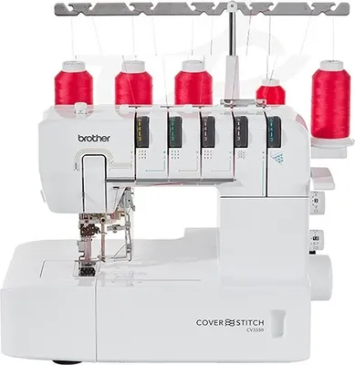 A white Brother Coverstitch sewing machine with red thread spools on top.