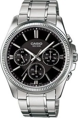 A close-up studio shot of a men's Casio watch with a black dial and silver metal band.