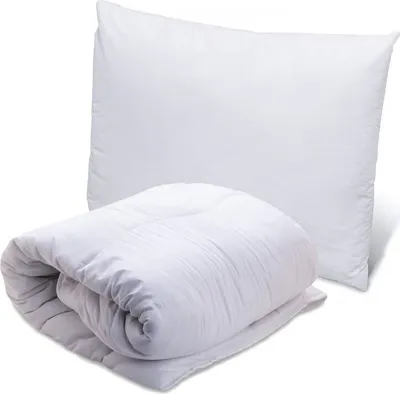 A white pillow and a folded white comforter are shown against a white background.