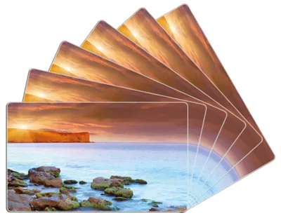 Produktbild von Wallario Frühstücksbrettchen 6er Set aus Glas, je 14 x 23 cm, mit rutschfesten Füßen, Motiv Sonnenaufgang am Meer mit Landzunge und Felsen im Wasser
