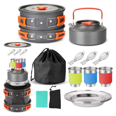 A collection of camping cookware and accessories laid out on a white background.