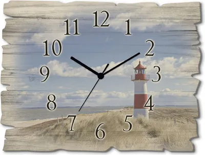 A clock face with a beach and lighthouse scene.