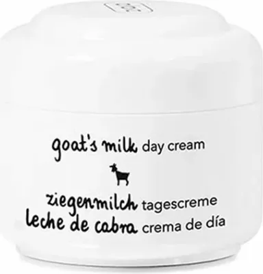 A white jar of goat's milk day cream with text and a small goat illustration.