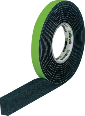 A roll of black foam tape with a green protective liner, with a section of tape unrolled.