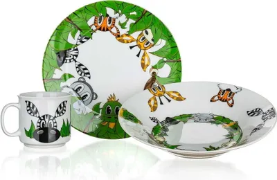 A set of children's tableware with jungle animal illustrations.
