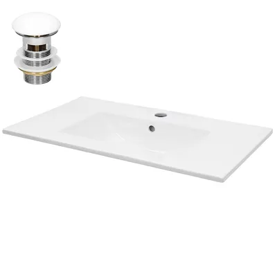 A white ceramic sink with a pop-up drain assembly.
