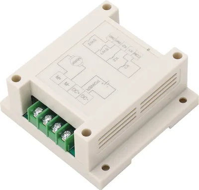 A white electronic module with a circuit diagram printed on top and green screw terminals on the side.