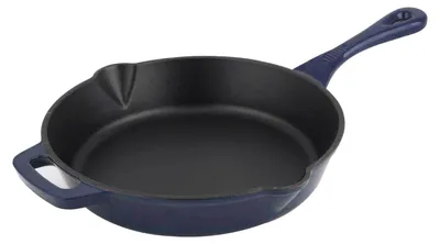 A dark blue cast iron frying pan is shown from a slightly elevated side angle against a white background.