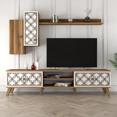 A TV stand and wall unit with a television and decorative items.