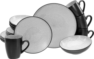 A set of stoneware dishes and mugs arranged on a white background.