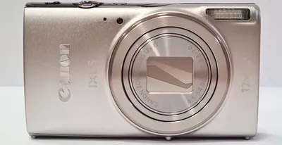 A silver Canon Ixus 285 compact camera is shown from the front against a white background.