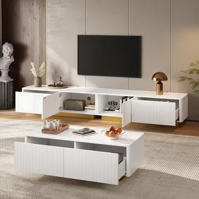 Immagine prodotto di Set Merax composto da un mobile TV basso e un tavolino da caffè, 2 pezzi. Il tavolino da caffè ha un fronte scanalato, mentre il mobile TV è dotato di cassetti. Arredamento moderno per il soggiorno, realizzato in MDF, colore bianco