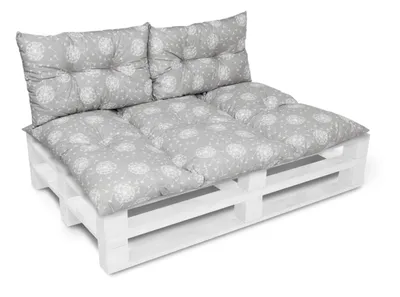 A white pallet sofa with gray cushions with a white pattern, shown from a diagonal front-left angle on a white background.