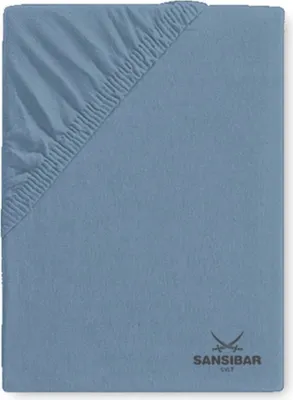 A close-up view of a blue fitted sheet, showing the elasticized corner.