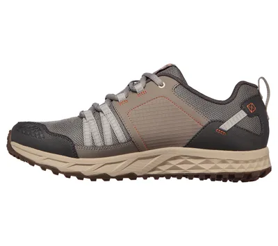 Side view of a single athletic shoe.