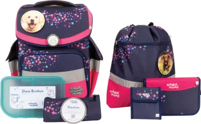 A collection of school supplies including a backpack, a drawstring bag, a pencil case, a lunchbox, and a wallet, all featuring a navy blue and pink star pattern and dog imagery.