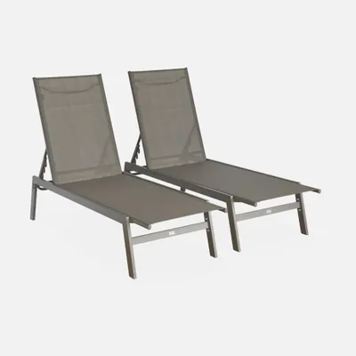 Two lounge chairs are shown against a plain background.