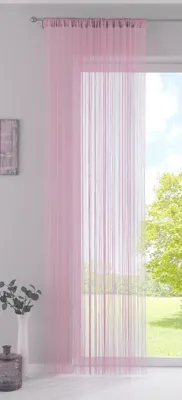 A pink string curtain hanging in front of a window with a view of trees and sky.