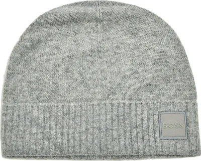 A close-up studio shot of a grey beanie hat.