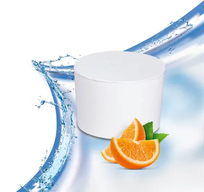A white cylindrical container with orange slices and green leaves next to it, with blue water splashes in the background.