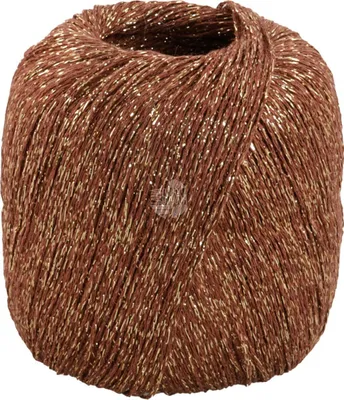 A single ball of yarn with metallic gold threads.