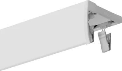 A close-up, angled view of a white aluminum curtain rail with a decorative front panel and visible mounting clips and gliders.