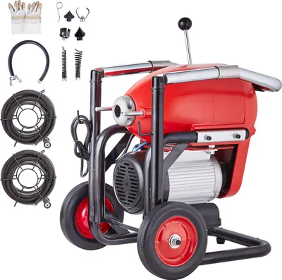 A red and black electric drain cleaning machine with accessories, presented on a white background.