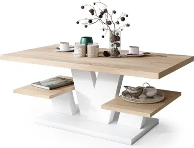 A modern coffee table with a wood-effect top and white base, decorated with a vase of branches and two cups.