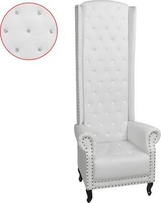 A white high-back armchair with tufted upholstery and decorative nailhead trim.
