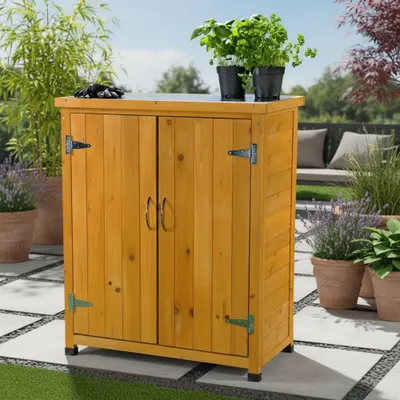 A wooden storage cabinet on a patio with plants.
