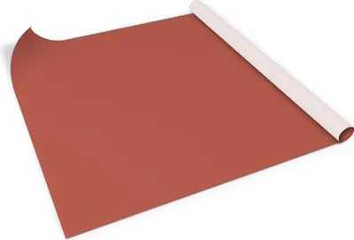 A roll of brown adhesive furniture film is partially unrolled on a white surface.