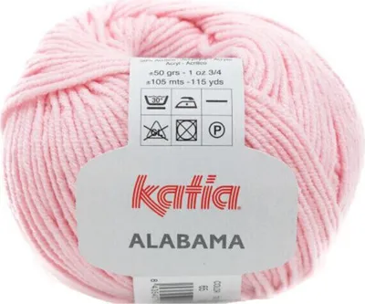 A ball of pink yarn with a label attached.