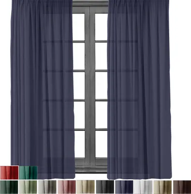 A pair of blue curtains hanging in front of a window.