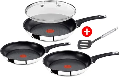 A set of three Tefal frying pans and a spatula, presented on a white background.