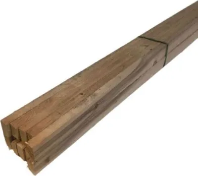 A bundle of wooden planks tied together with green twine, presented on a white background.