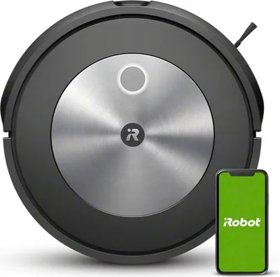 A top-down view of a black robot vacuum cleaner with a silver metallic top, next to a smartphone displaying the iRobot logo.